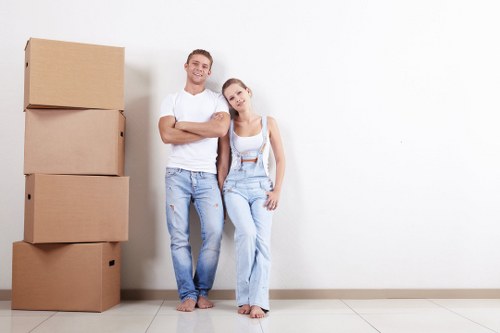 Removal team handling a home move in Hammersmith streets