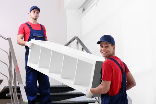 Man and van worker loading items safely into a vehicle