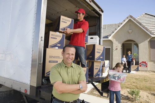 Professional movers handling furniture for a flat in Hammersmith