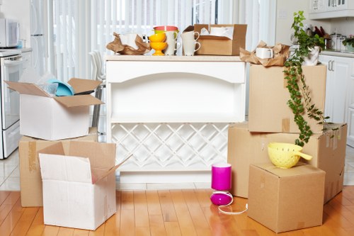 Commercial moving team preparing desks, boxes, and office furniture for relocation in Hammersmith