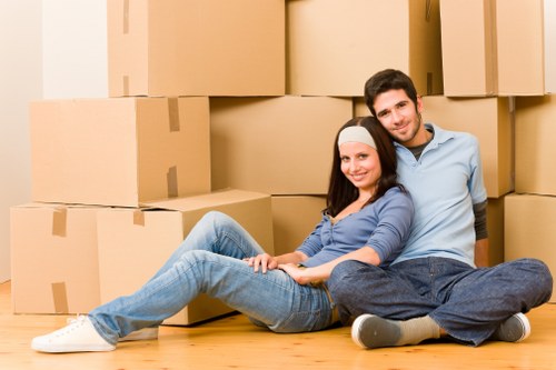Careful loading of sofas, tables, and boxes for a move in West London