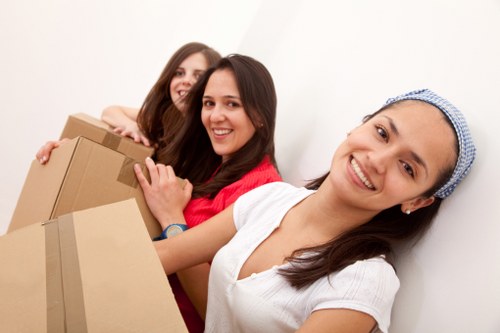 Packed boxes and furniture ready for transport in a West London removal van