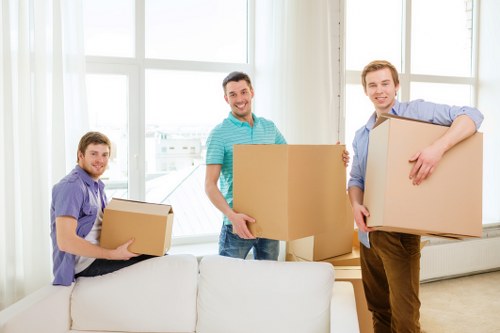 Stacked moving boxes and packing materials prepared for a Hammersmith home move