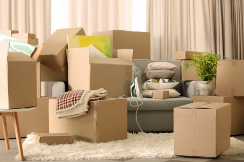 Packed boxes and furniture ready for removals in a Hammersmith flat