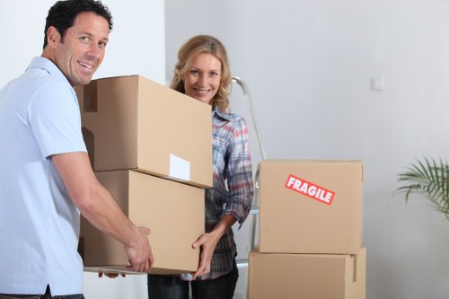 Professional movers using PPE during a safe removal in Hammersmith