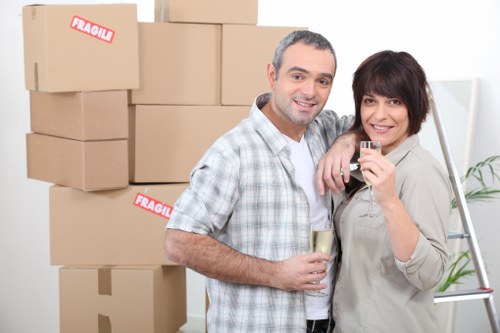 Professional movers transporting office furniture in the Hammersmith area